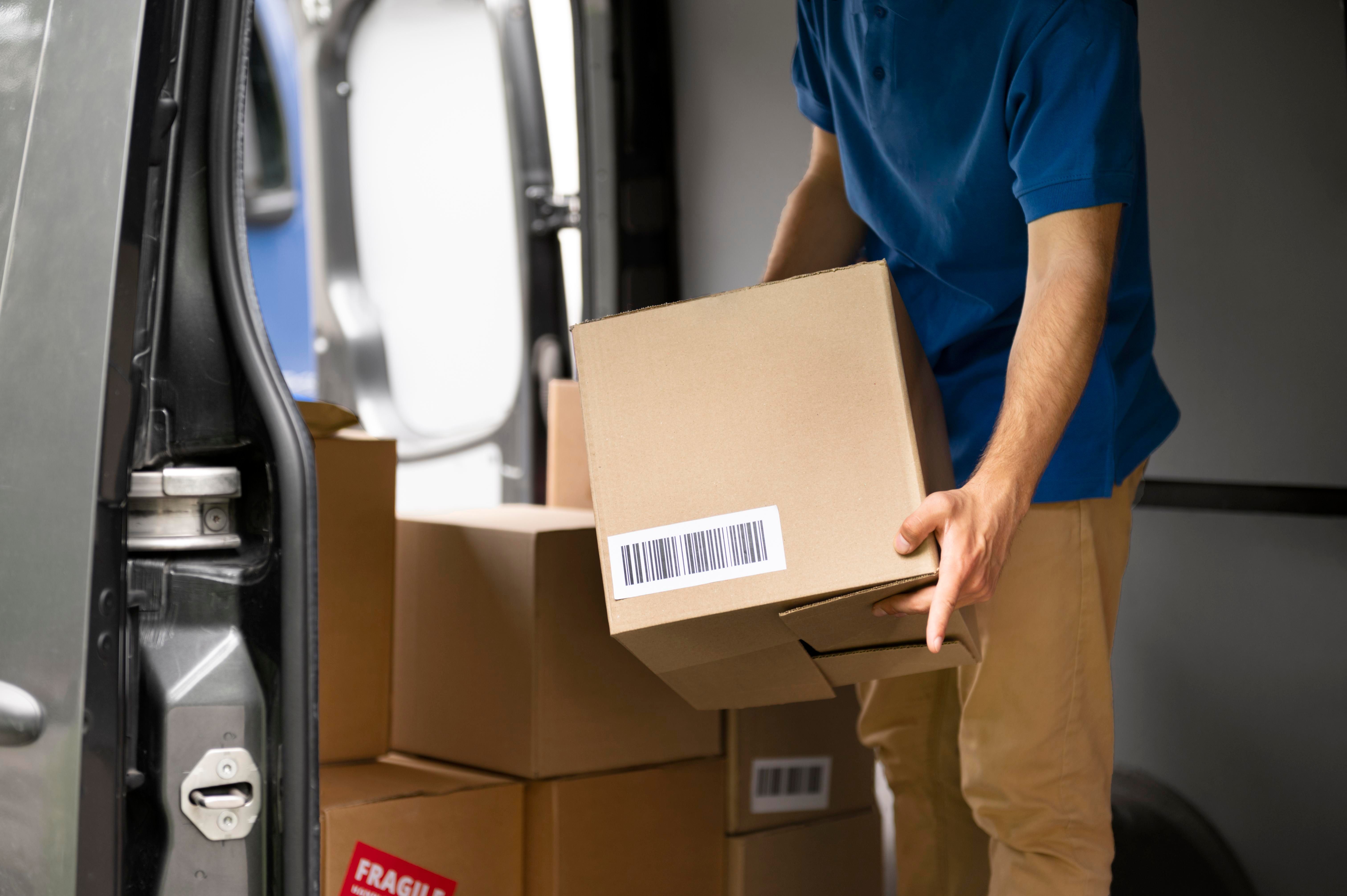 close_up_hands_carrying_box_098d595f82.jpg